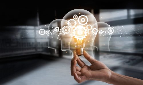 Hand holding light bulb and cog inside. Idea and imagination. Creative and inspiration. Innovation gears icon with network connection on human heads on metal texture background. Innovative technology in science and industrial concept